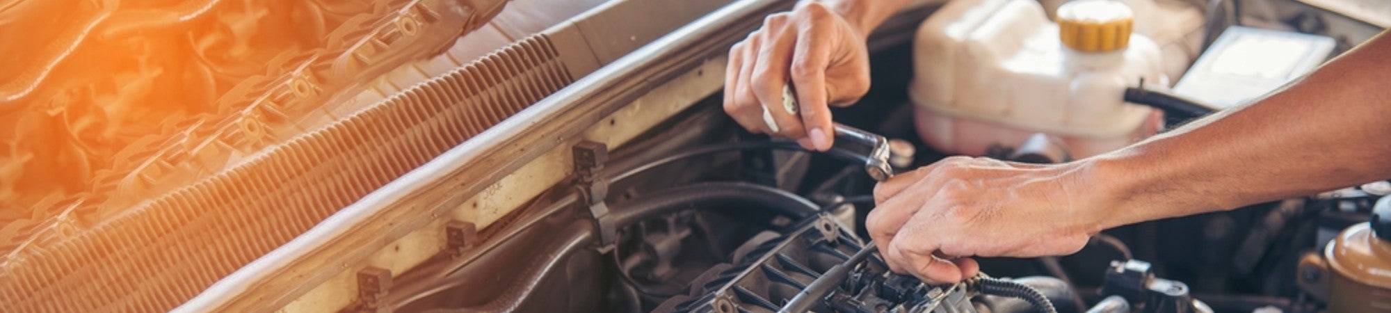 Mechanic Working on Engine